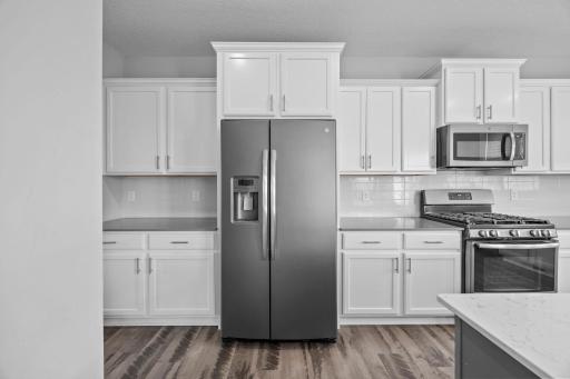 Stainless appliances with vented microwave fan