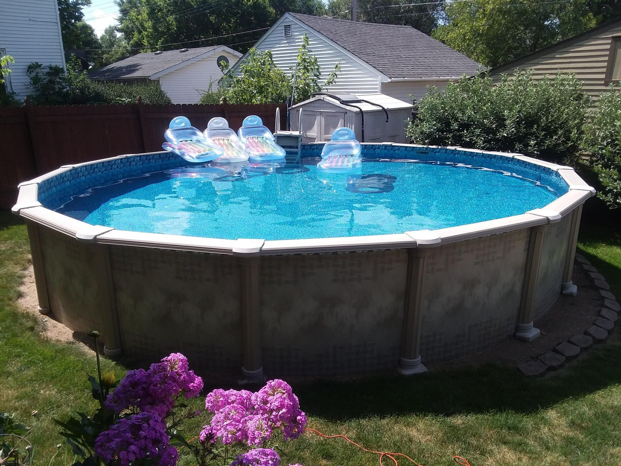 24 ' Diameter 52" deep above ground pool with brand new liner, pump and filter system all ready to enjoy
