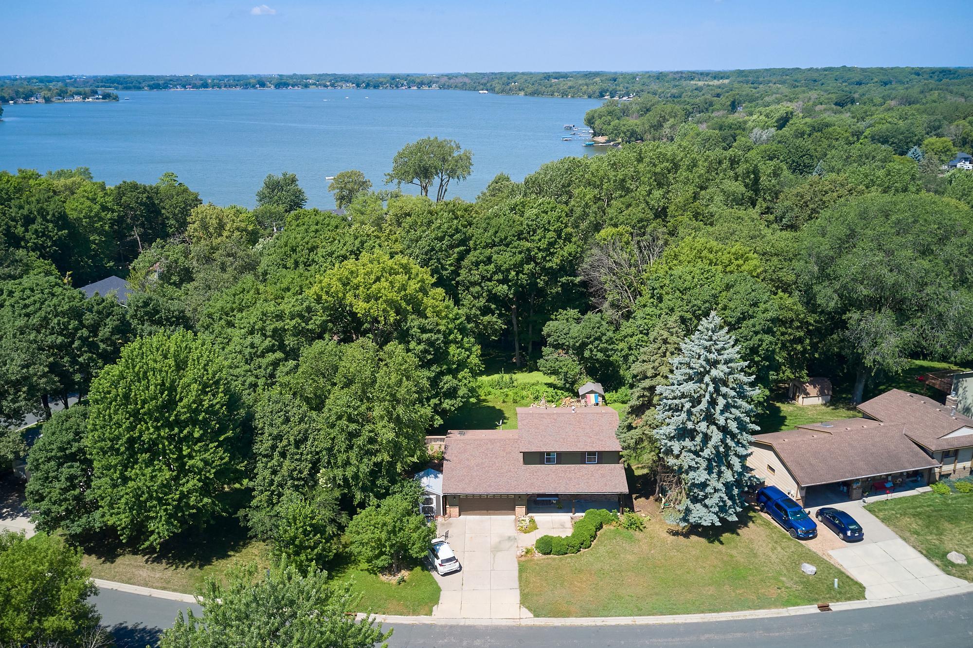 One block from Spring Lake, a few blocks from Upper Prior Lake, and within walking distance of Sunset Hills Park and Woodview Park. Large fenced yard, concrete driveway, siding painted in 2025.
