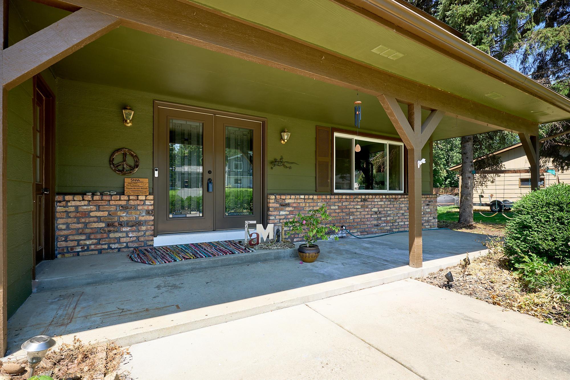 Beautiful front porch, perfect for long Minnesota 'good-byes' & welcoming guests; concrete patio; new front door; exterior painted in 2025; 13 new windows.