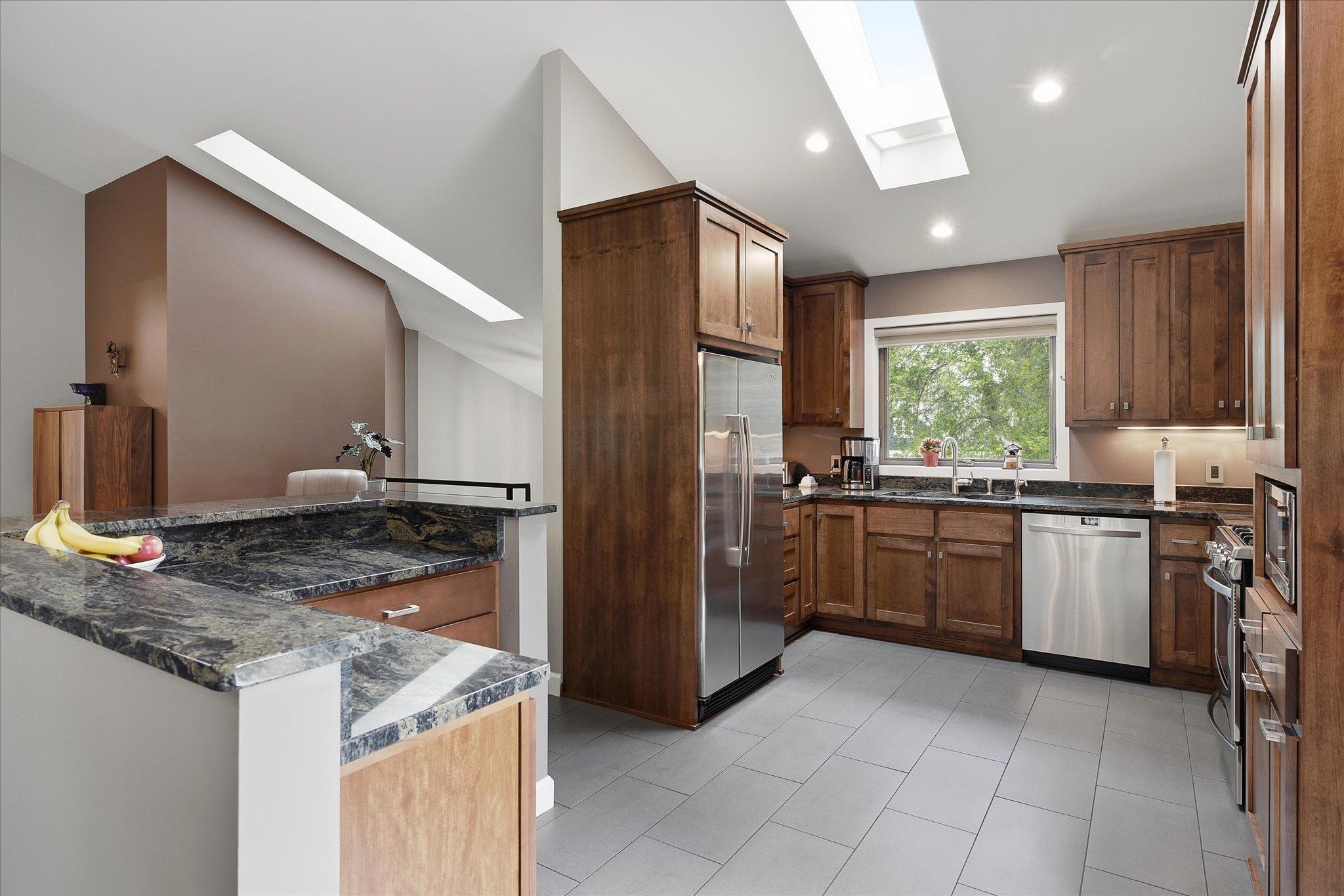 Another view of the kitchen and breakfast bar