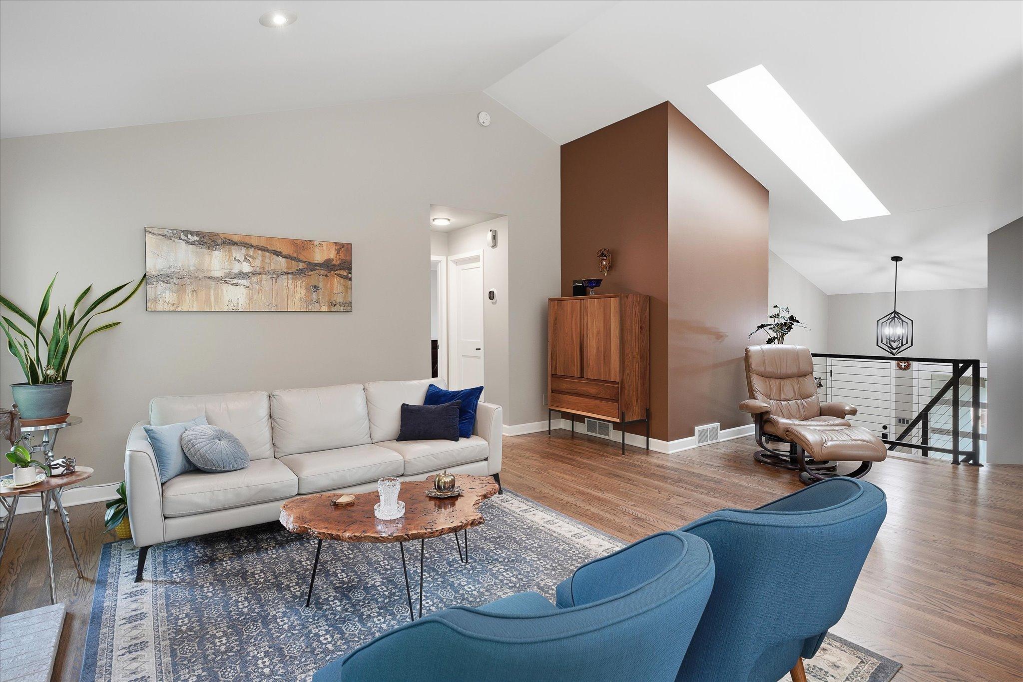 Living room with vaulted ceilings and beautiful hardwood floors