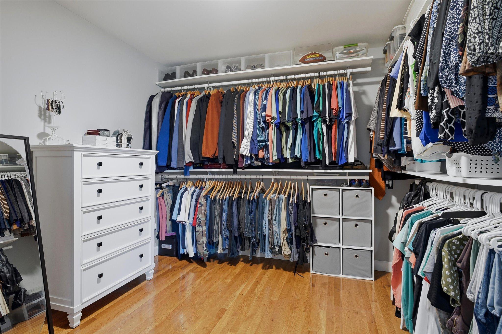 Walk-in closet with abundant shelves and storage