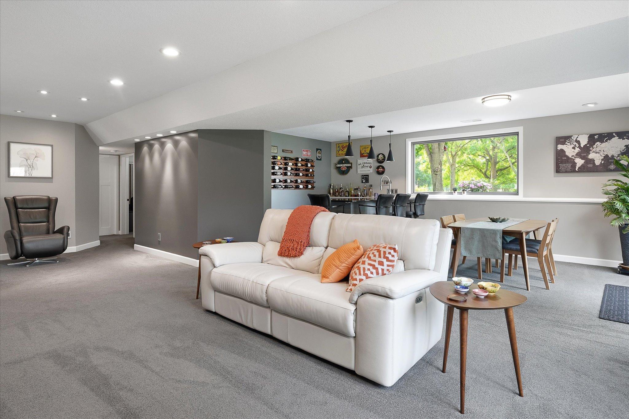 Large family room with wet bar and additional area for game table