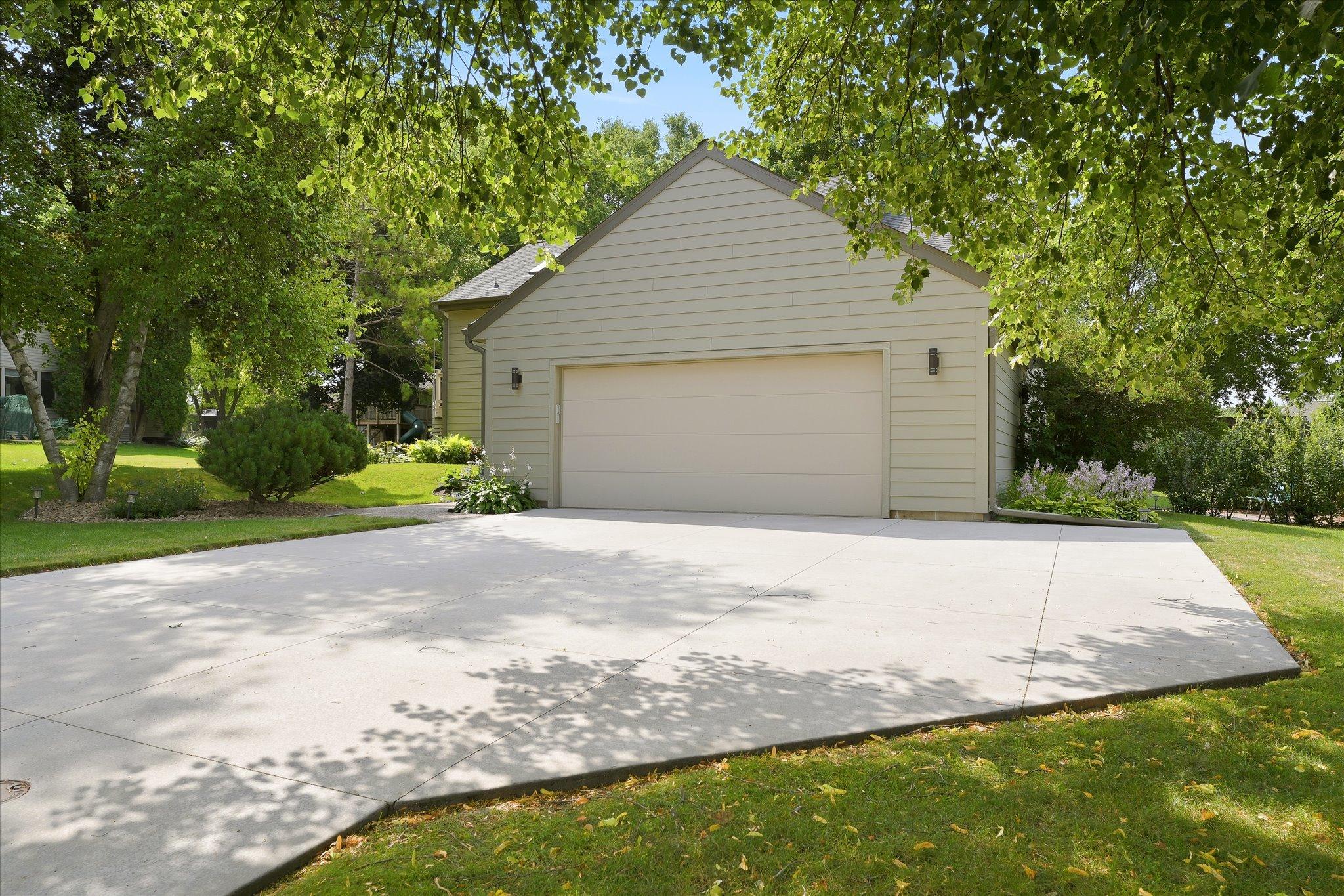 Concrete driveway with extra wide pad for additional parking