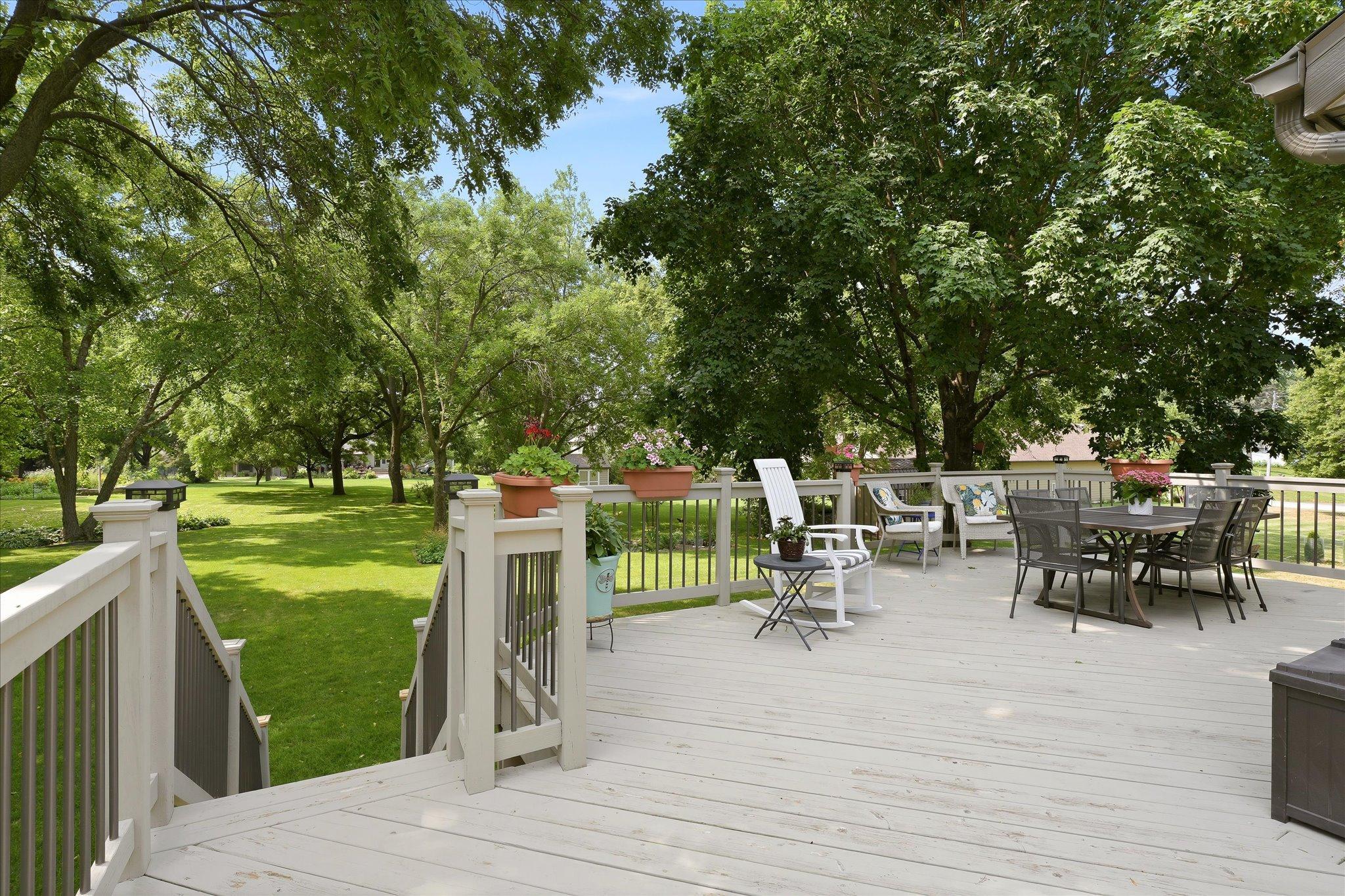 Large deck overlooking the park-like yard