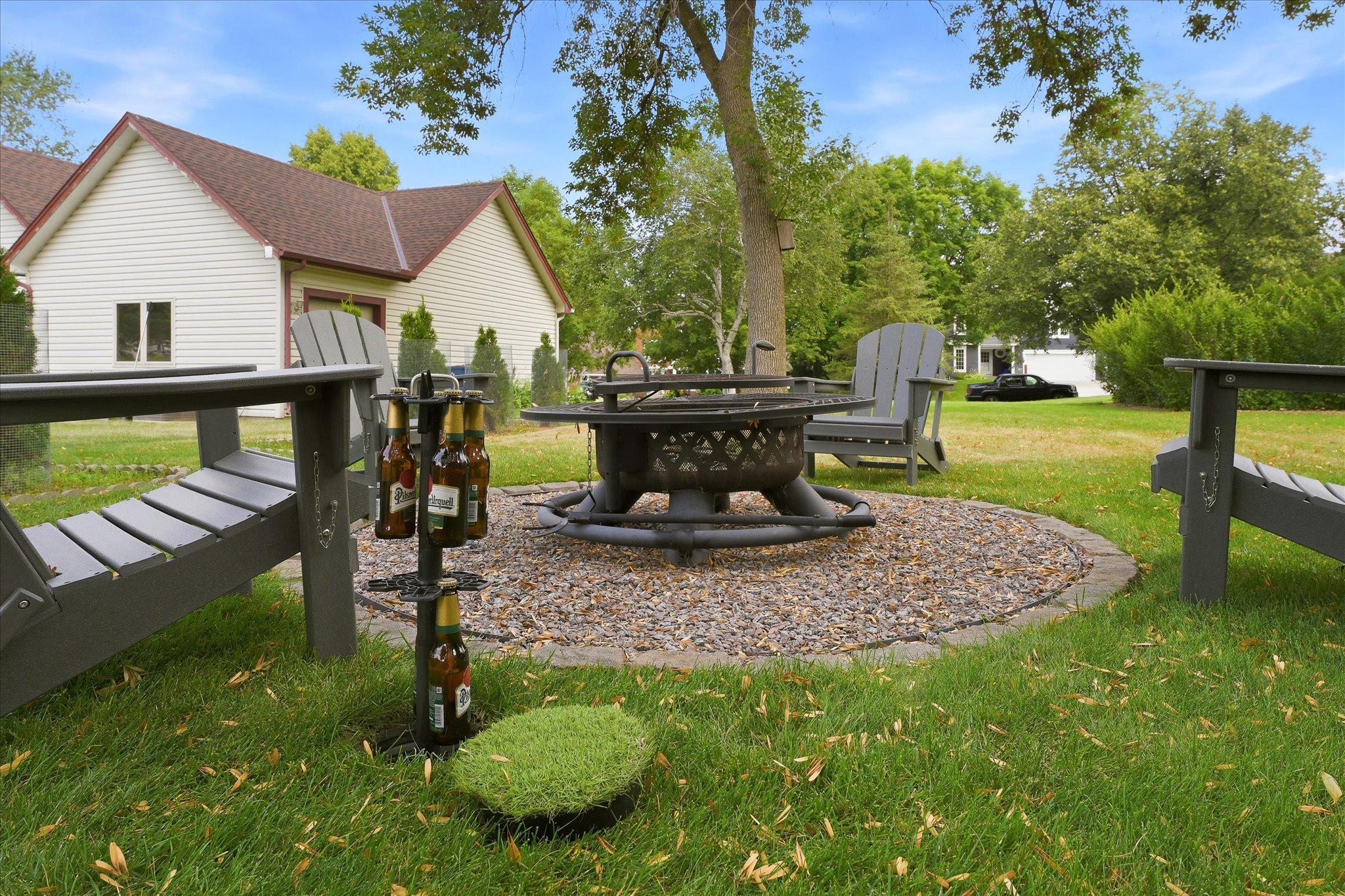 Firepit with a unique, in-ground beer bottle storage to keep your refreshments cool
