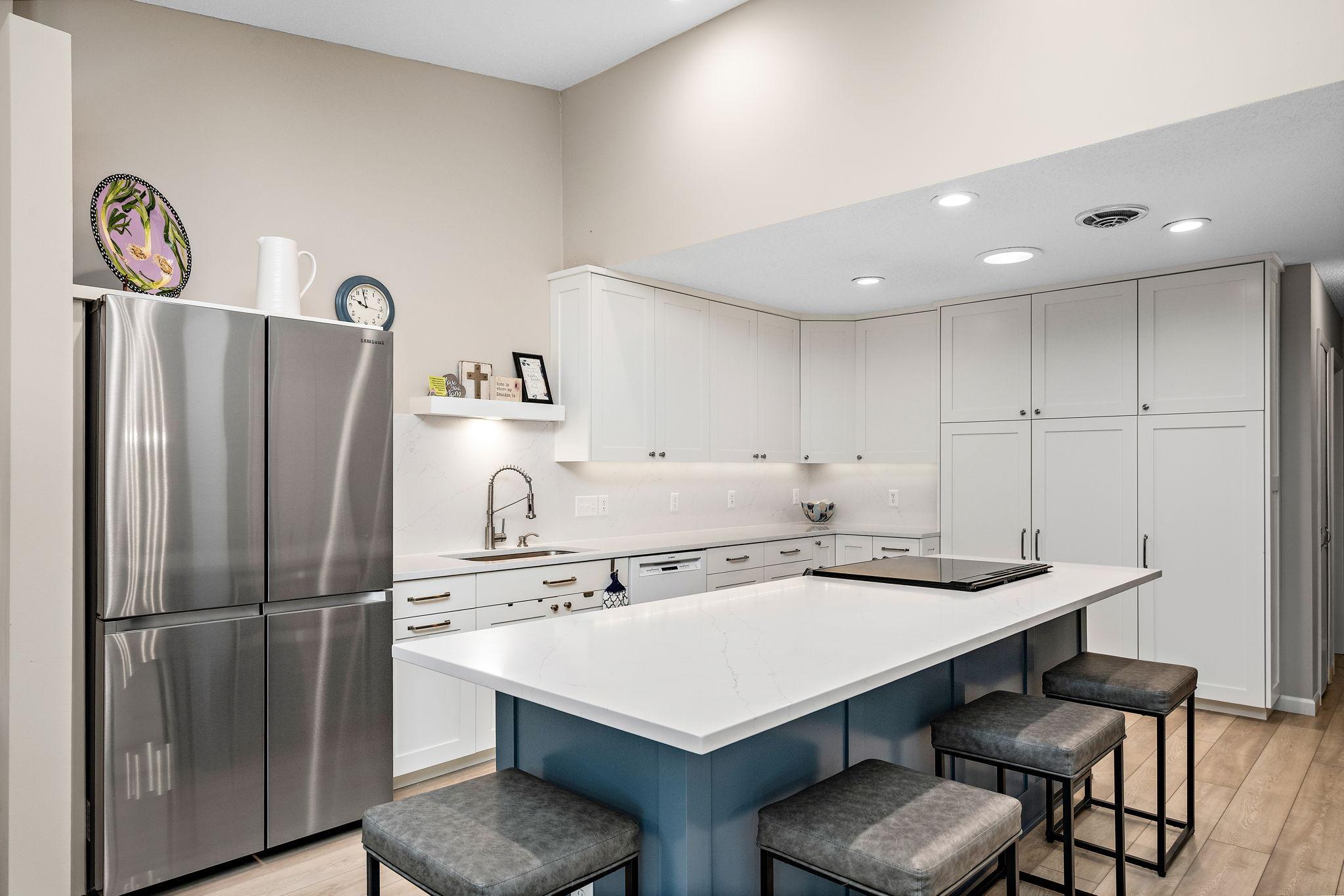 with plentiful storage, counter space and spacious center island