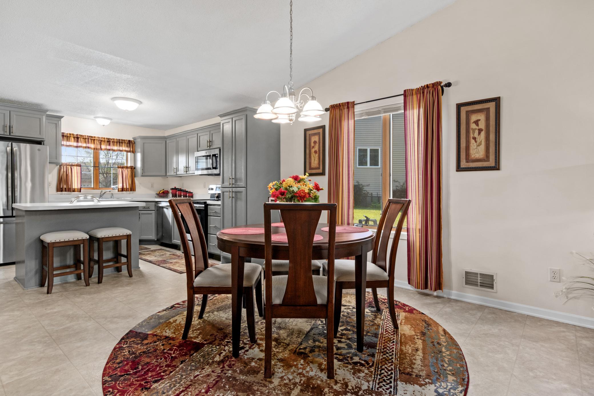 The dining area offers an inviting setting for everyday meals and entertaining