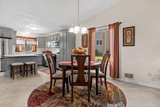 The dining area offers an inviting setting for everyday meals and entertaining