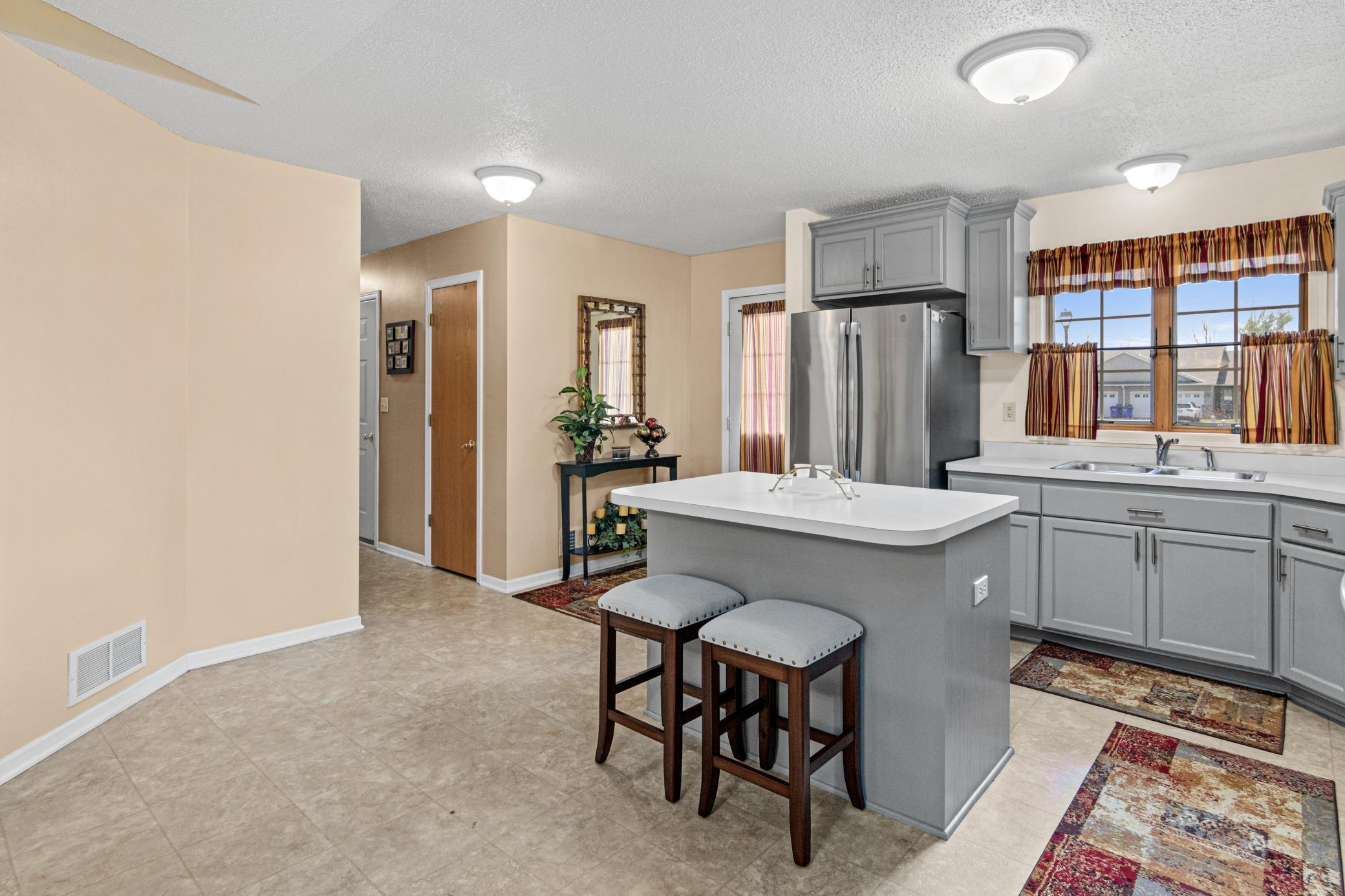 The kitchen center island adds valuable prep space and casual seating.