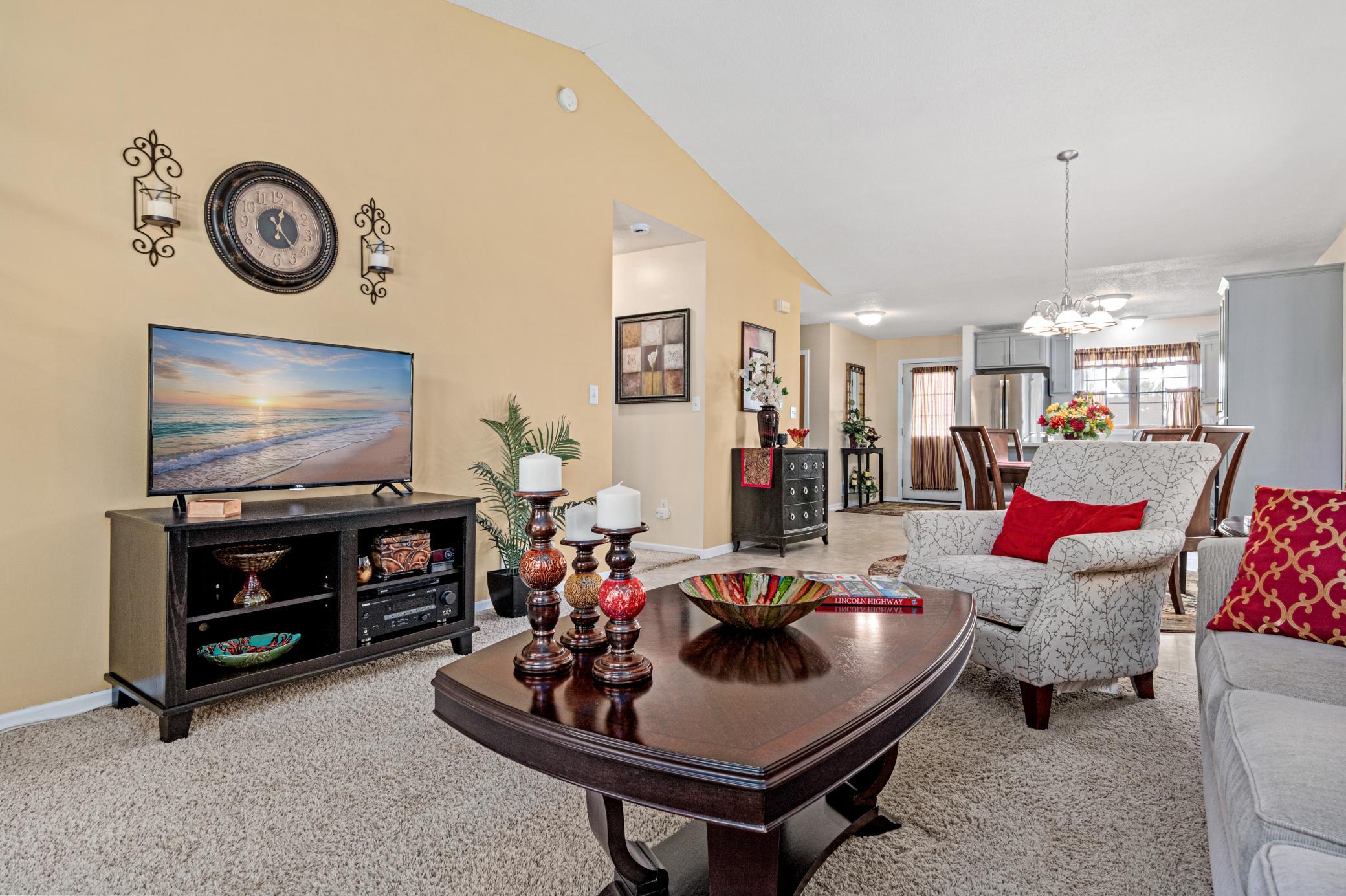 A generous living room offers plenty of space to gather, relax, and settle in
