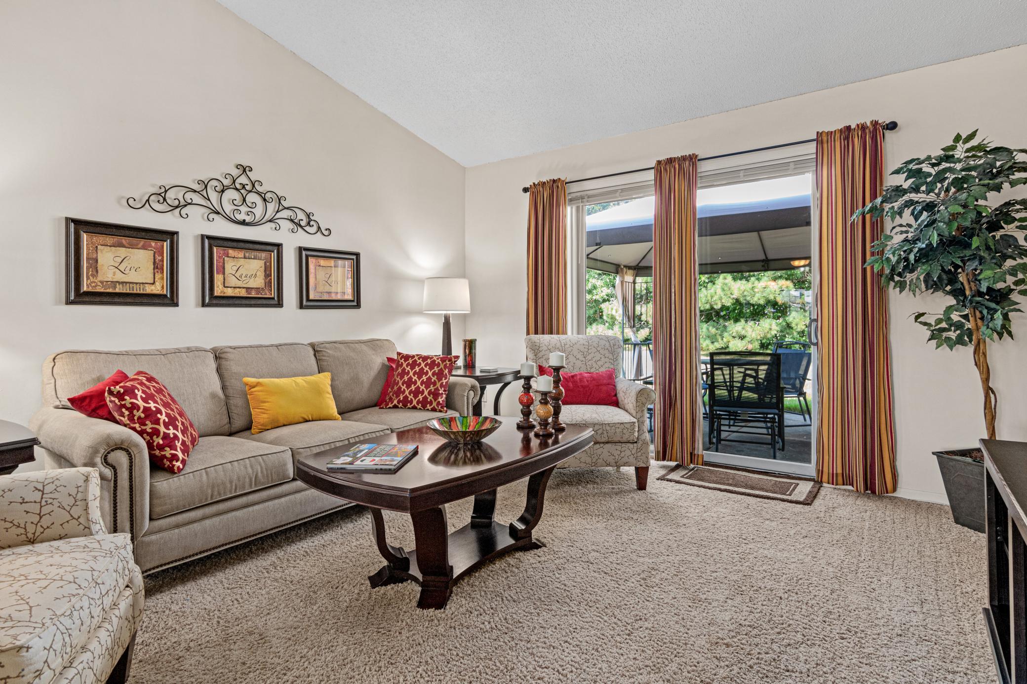 Vaulted ceilings add to the spacious feel, while the patio just beyond extends everyday living outdoors.