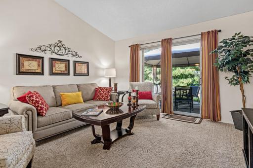 Vaulted ceilings add to the spacious feel, while the patio just beyond extends everyday living outdoors.