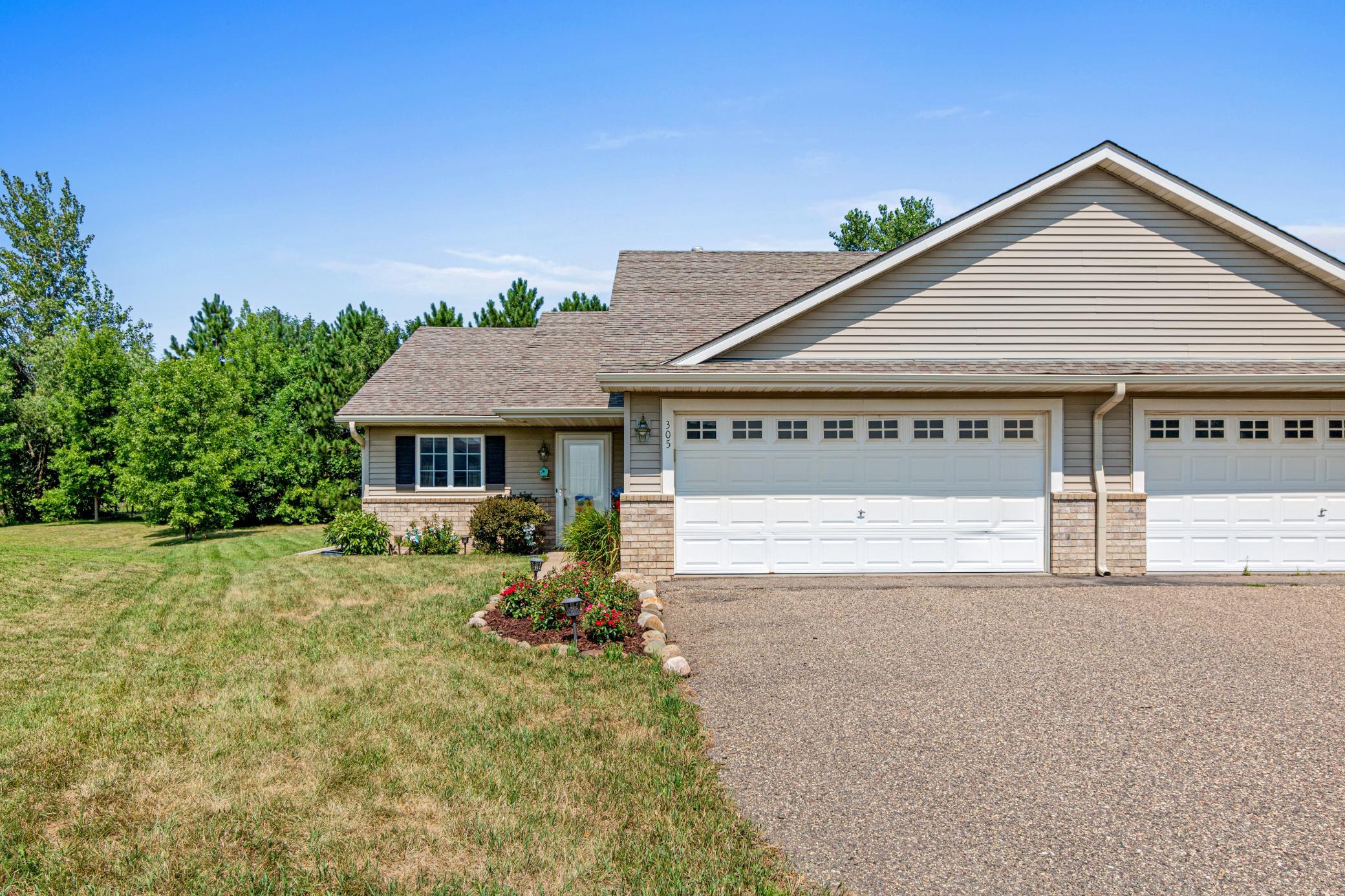 Set along a cul-de-sac in Rolling Meadows with convenient access to US-12 and WI-65
