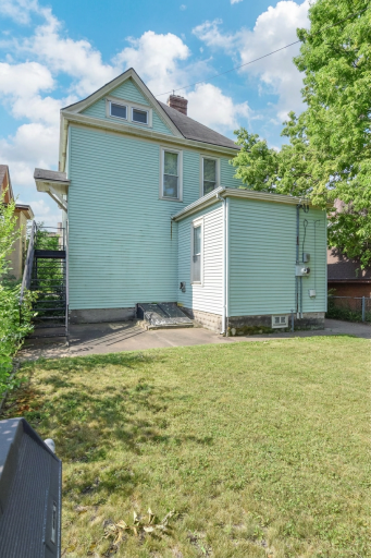 Stairs on the left are a separate entrance to the upper level which was a separate unit when home was separated into a duplex