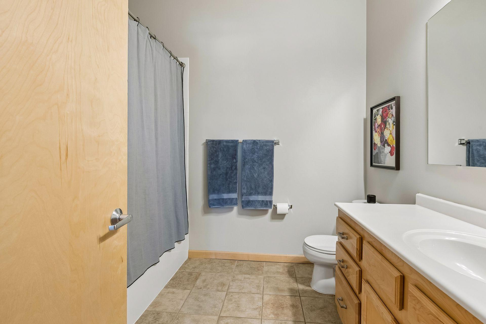 Another view and note the height of the ceiling at NINE FEET. Behind the door is a laundry closet.