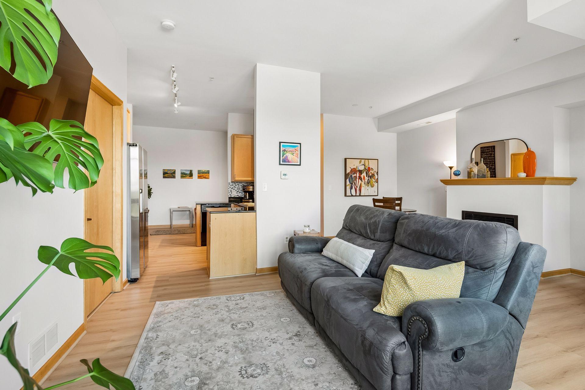 The ceilings are FLAT finish. This was an extra expense when this condo was new. The flooring is a beautiful and durable product that looks like wood.
