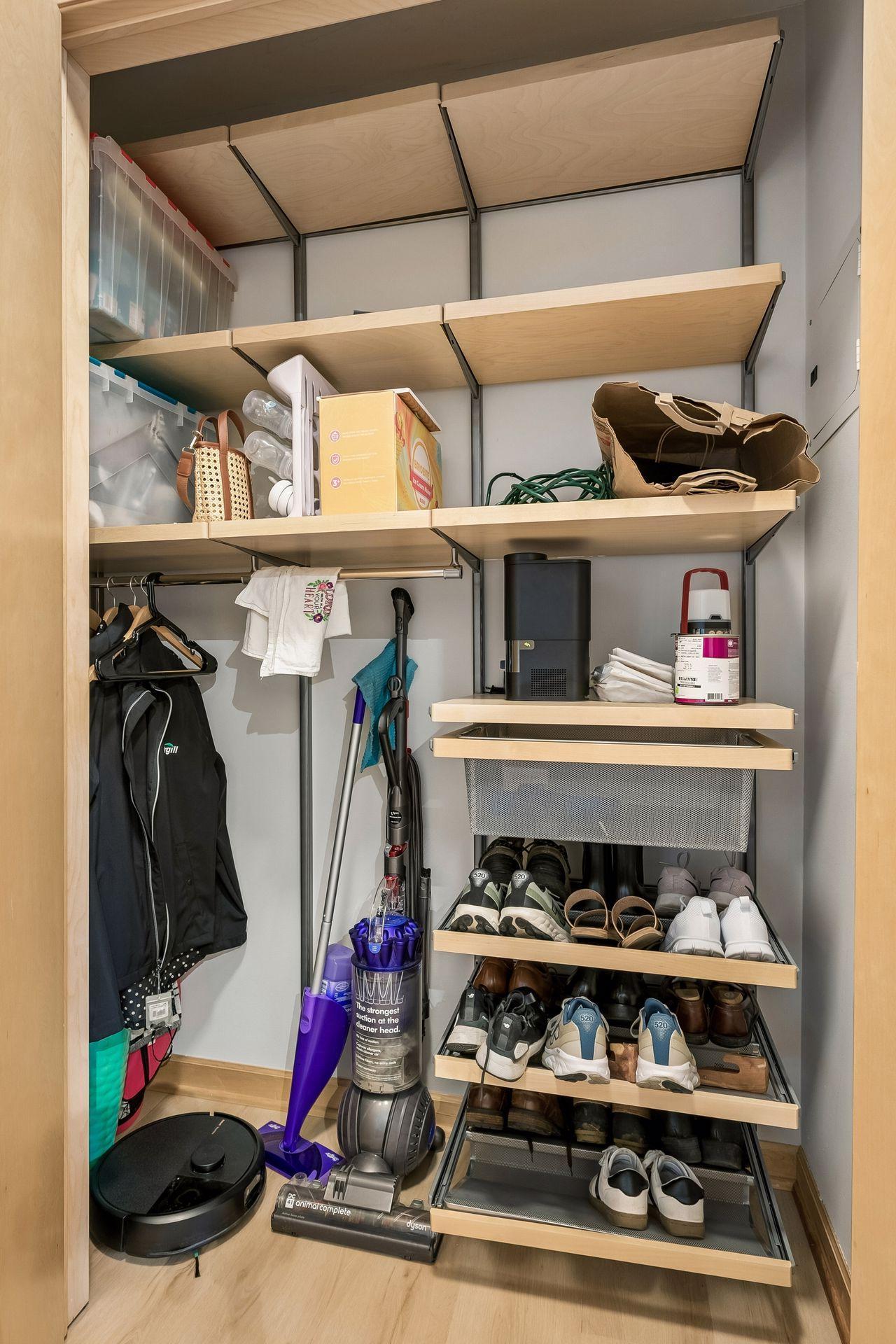 Inside the double closet is a smart organizer system.