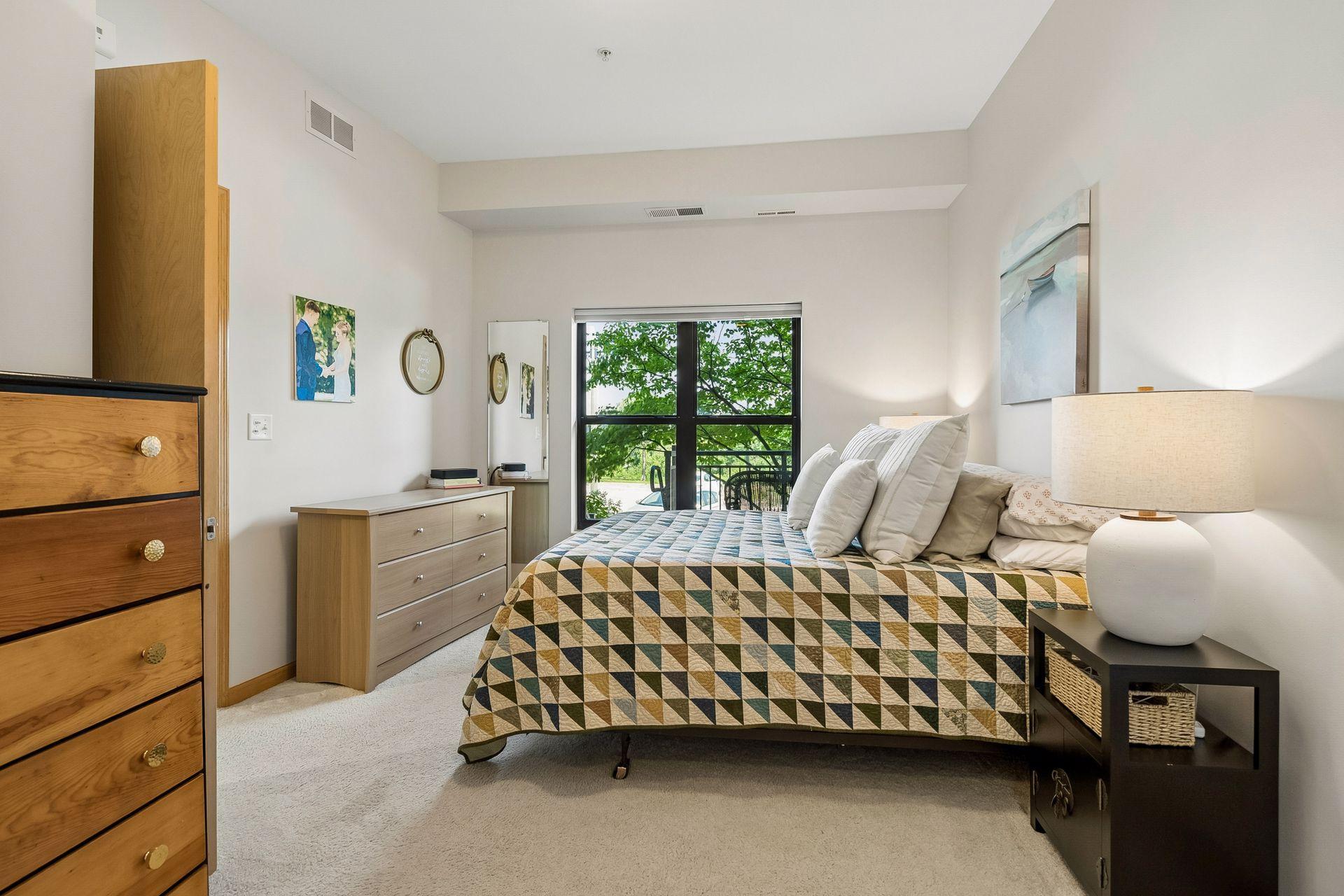 A long view of this bedroom that can easily hold two dressers.