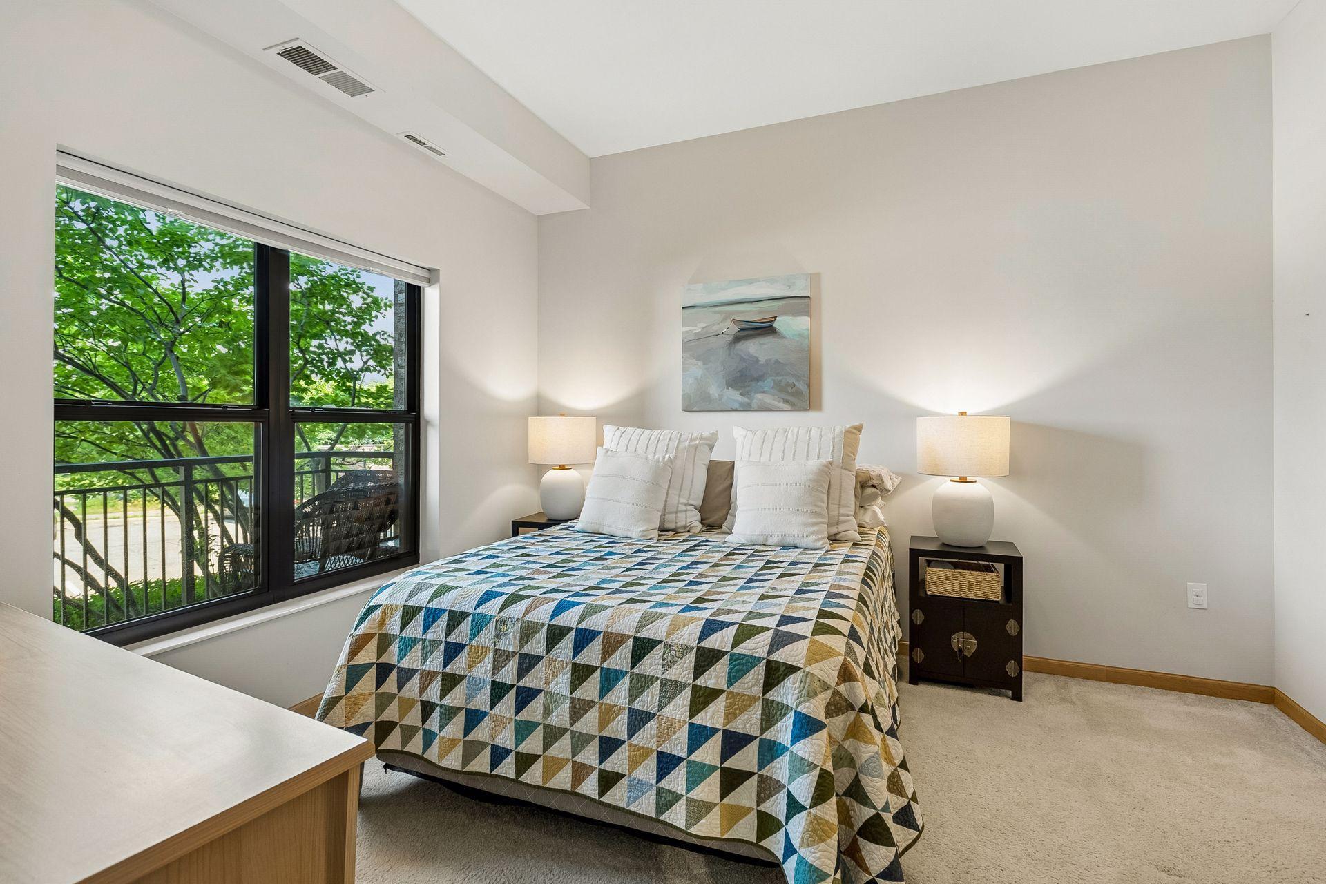 This bedroom is large and accommodates an even larger bed than this Queen sized one. Overlooking Wolfe Park and there are privacy blinds throughout.