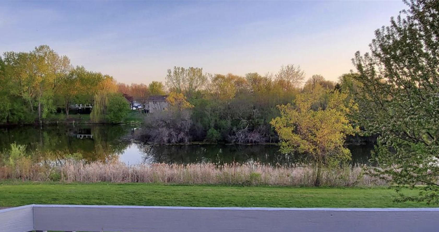 How about this view! Backyard overlooks a lovely pond, and walking path
