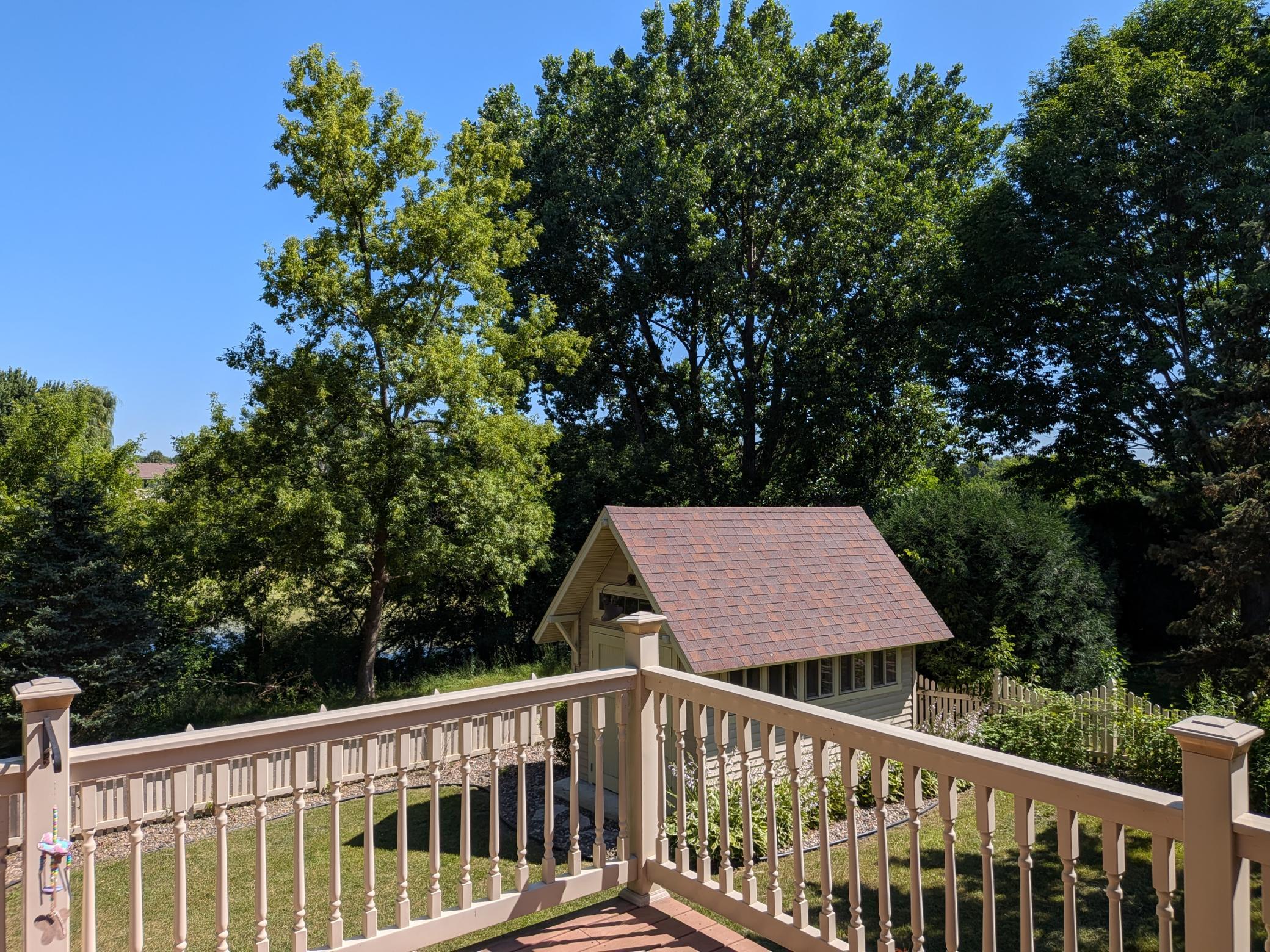 How about this view! Backyard overlooks a lovely pond, and walking path