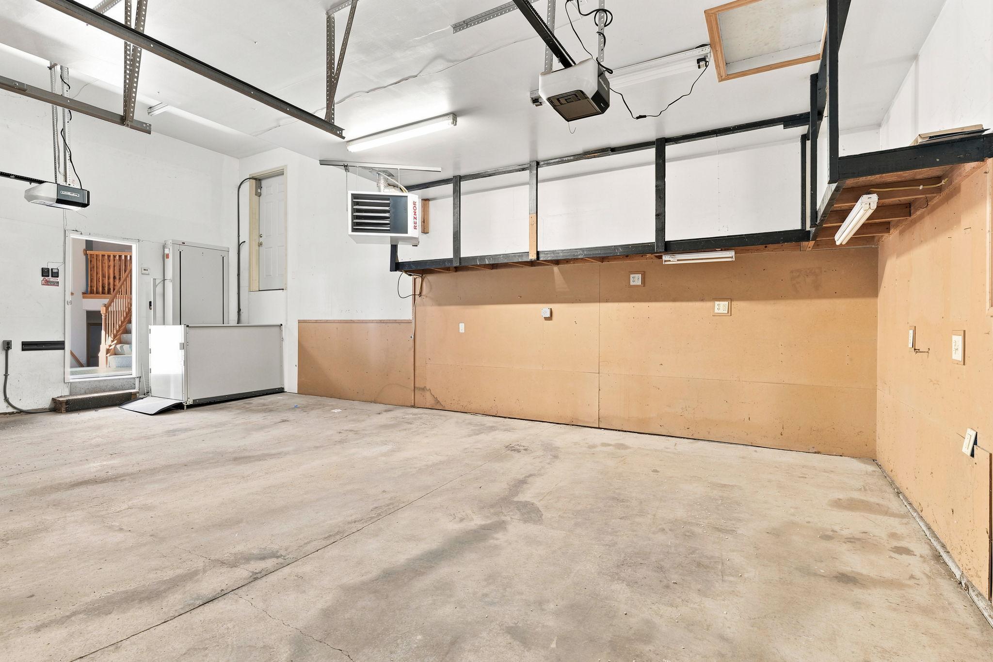 Spacious, 3-stall heated garage with elevator giving access to main-level.