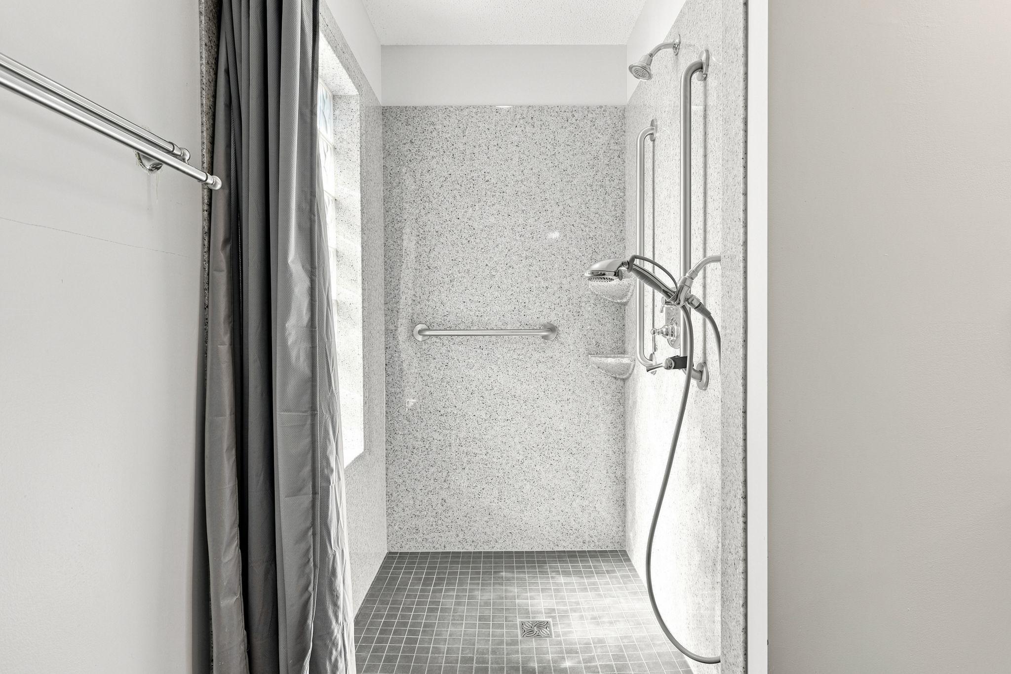 Main level 3/4 bathroom with walk-in shower.