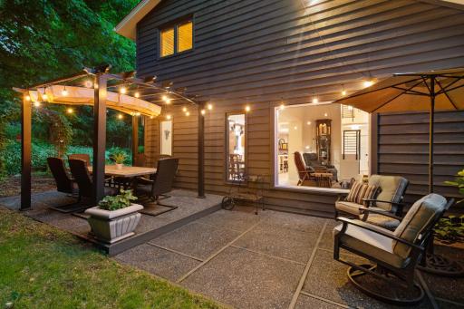 The retractable pergola shade and lights turn the patio into a true outdoor room.