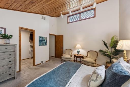 The primary bedroom includes a sitting area and walk-in closet.
