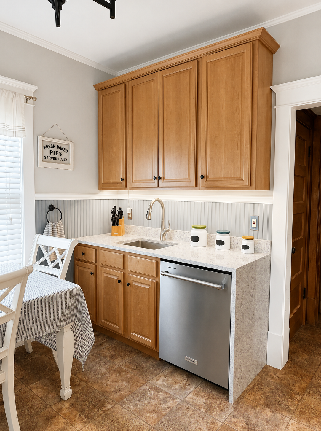 Silestone waterfall edge, under mount sink and updated appliances