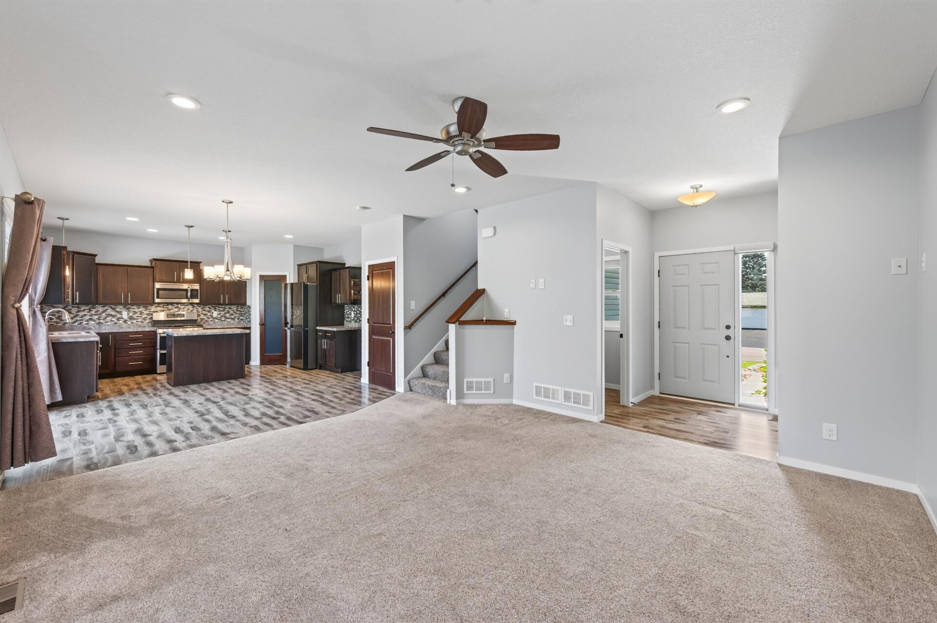 Main level kitchen, living room, 1/2 bath and front entry