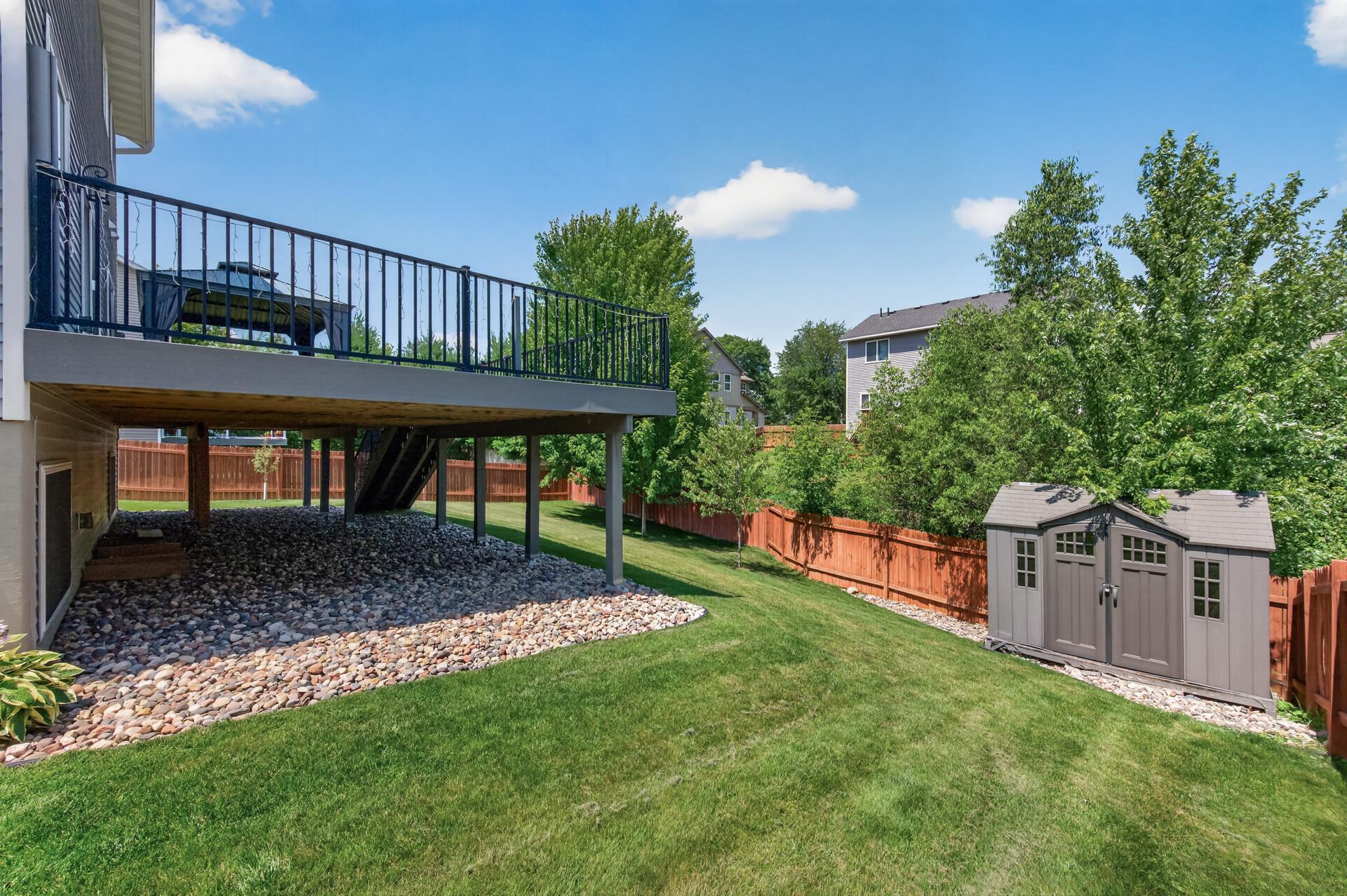 Back and side yard with storage shed
