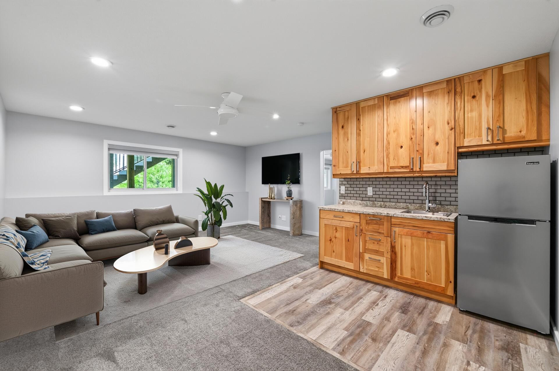 Lower level family room and wet bar - virtually staged