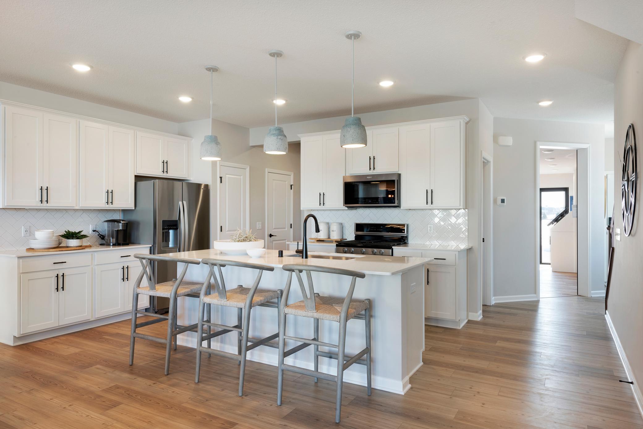Welcome to the Ashton! This thoughtfully designed home is the perfect balance between elegance and function! Photo of model home.