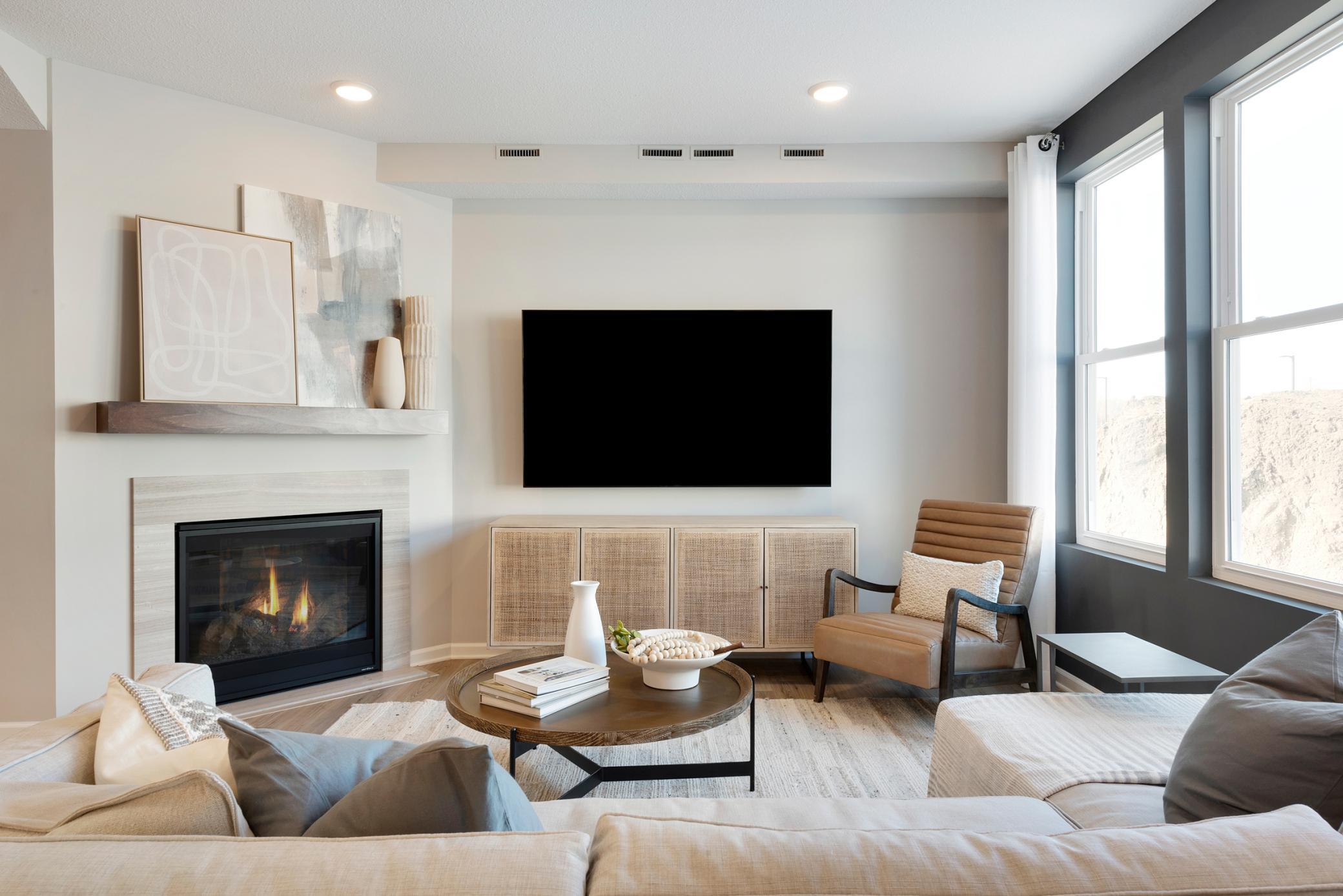 Cozy up on those cold Minnesota nights to your fireplace! (Option varies home to home). Photo of model home.
