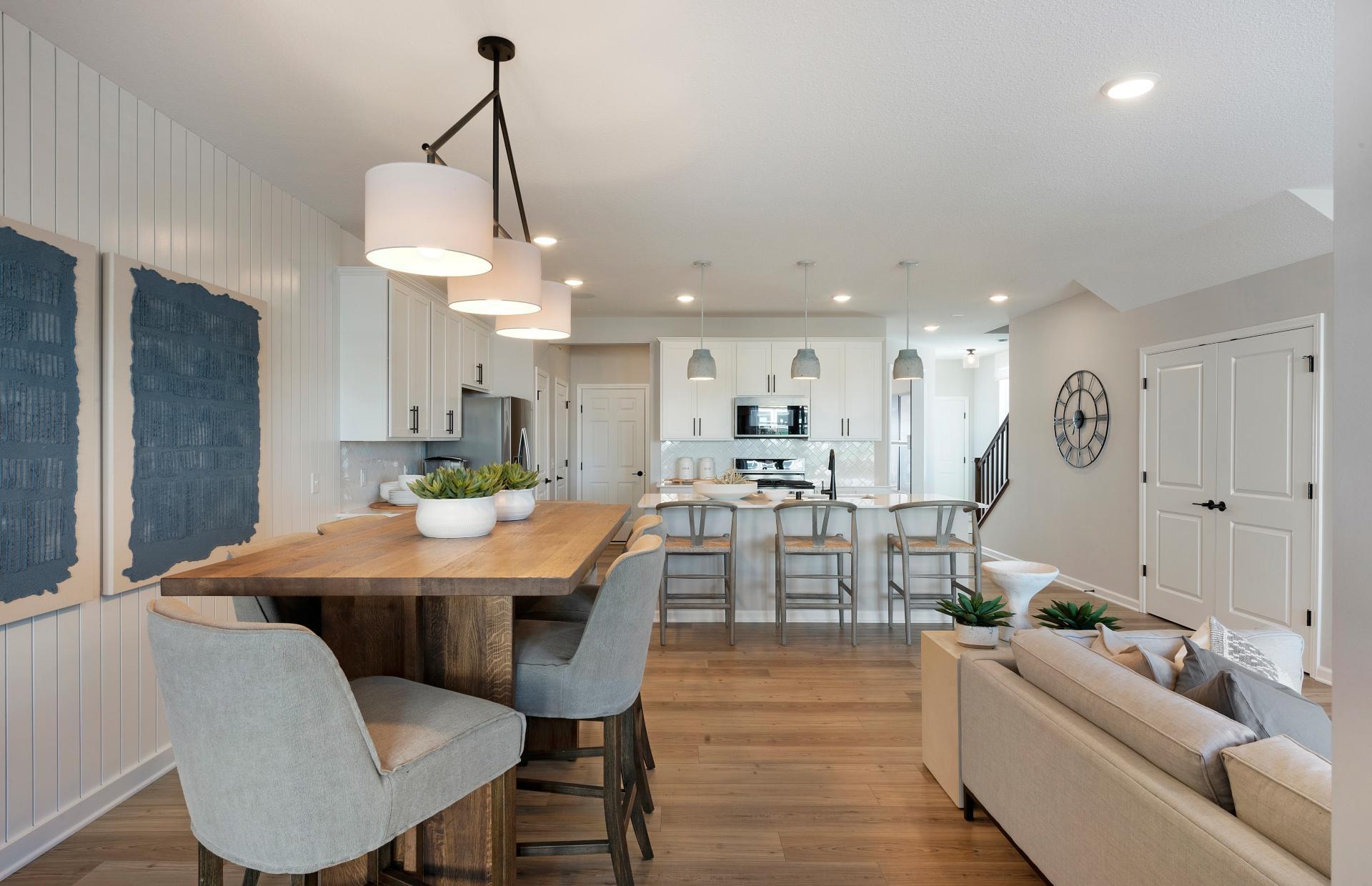Conveniently located off the kitchen we find the dining room! Perfectly sized to accommodate any table or set up you could want! Photo of model home.
