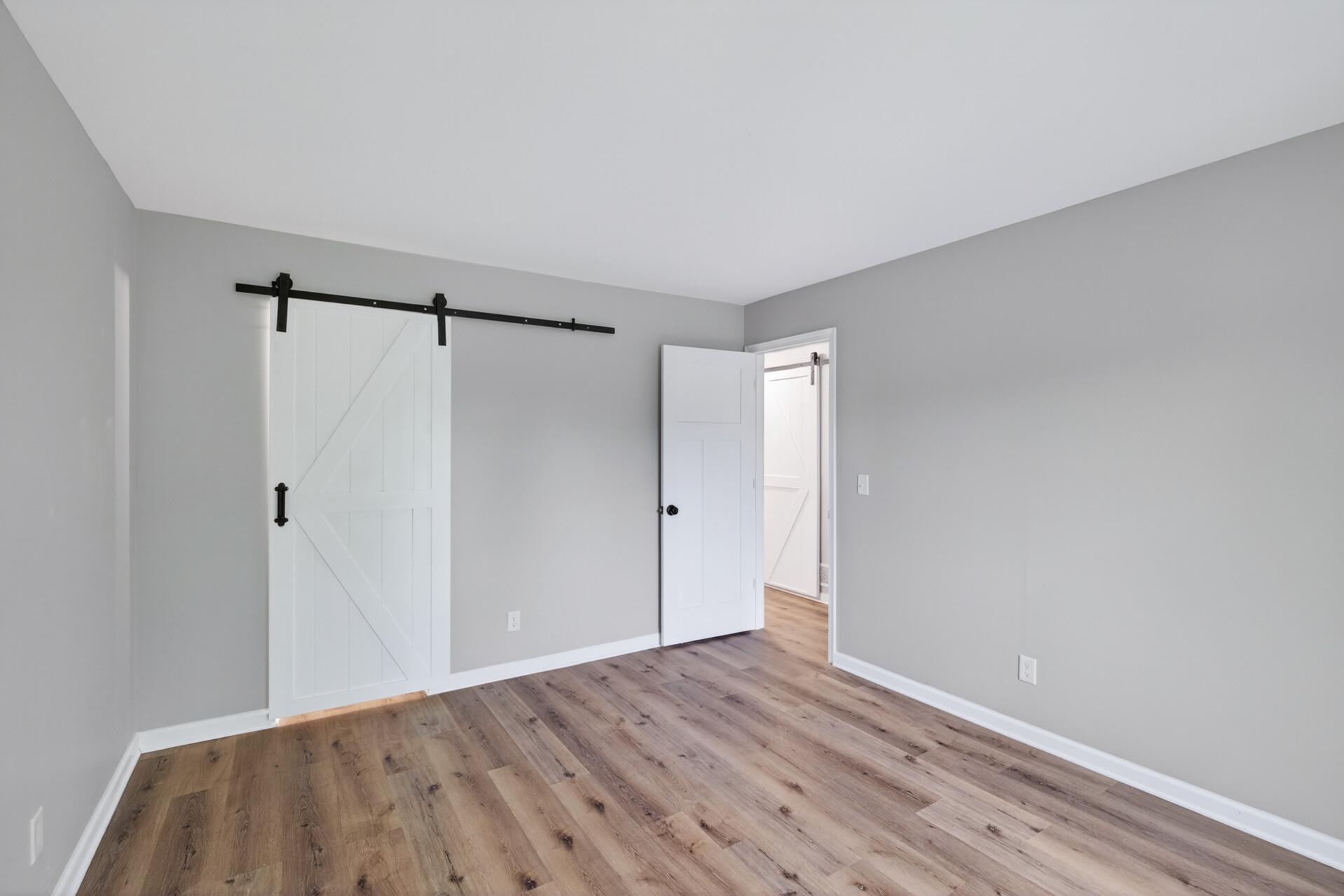 Primary suite with newly added private ¾ bath and walk-in shower.