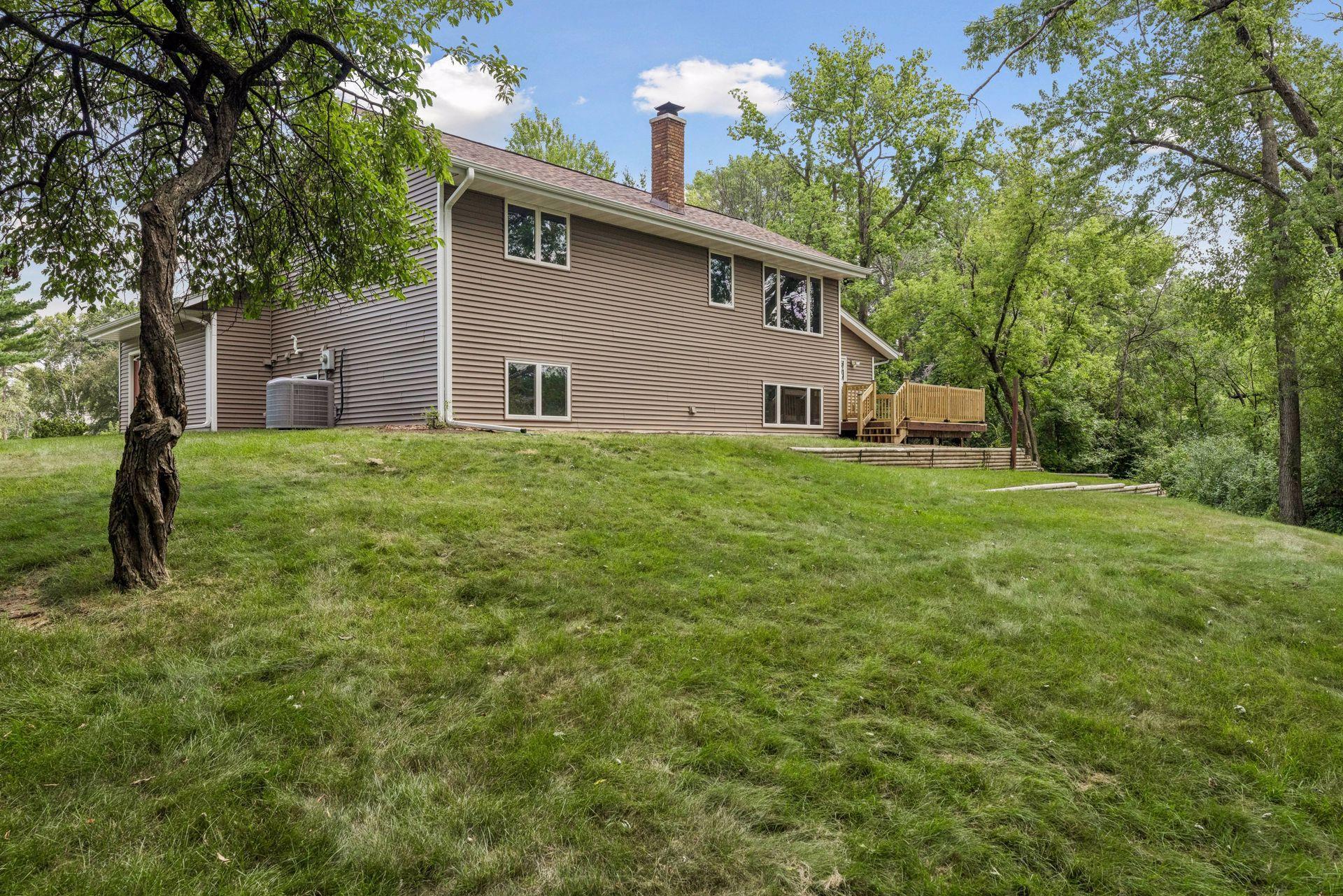 Home sits up and overlooks the backyard.