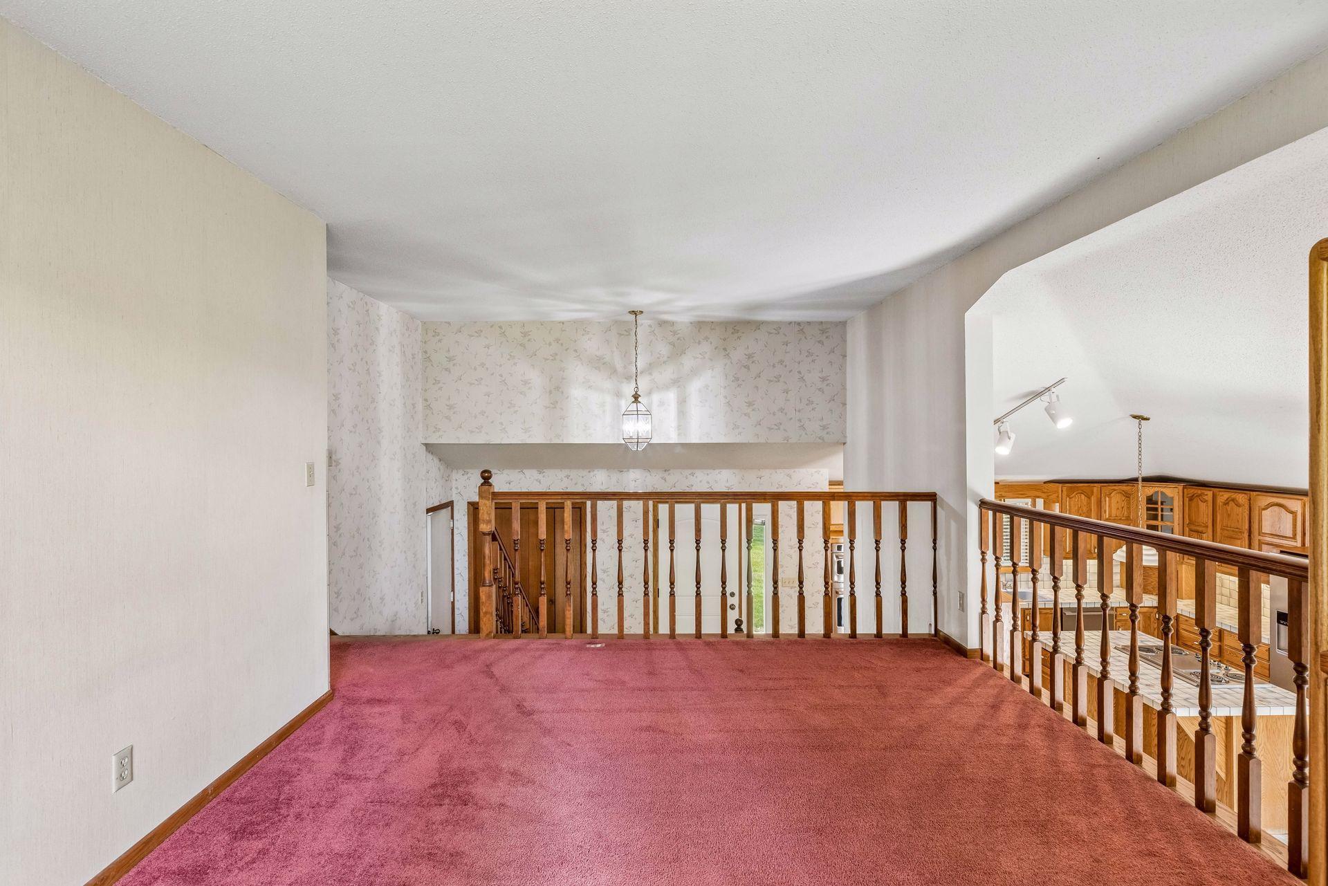 Space overlooks the front foyer and kitchen.