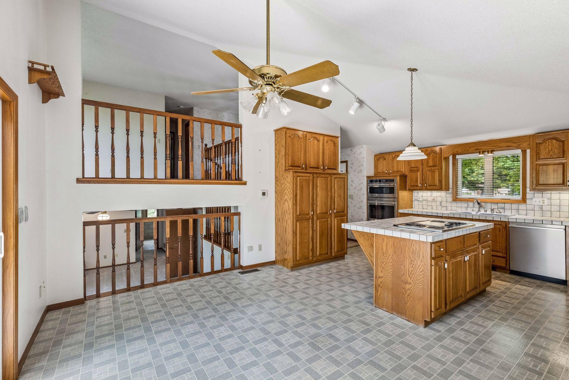 The space has an open wall to the upper living room and lower family room.