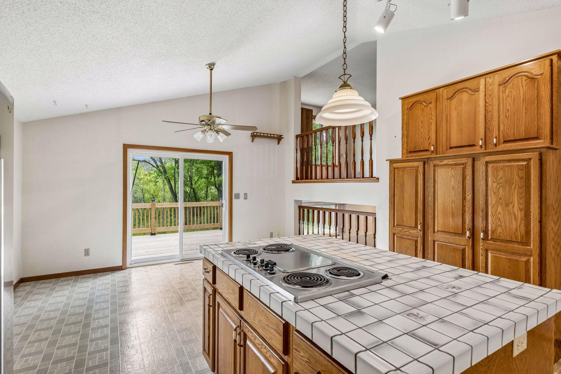 Shared dining space with walkout to the deck and backyard.