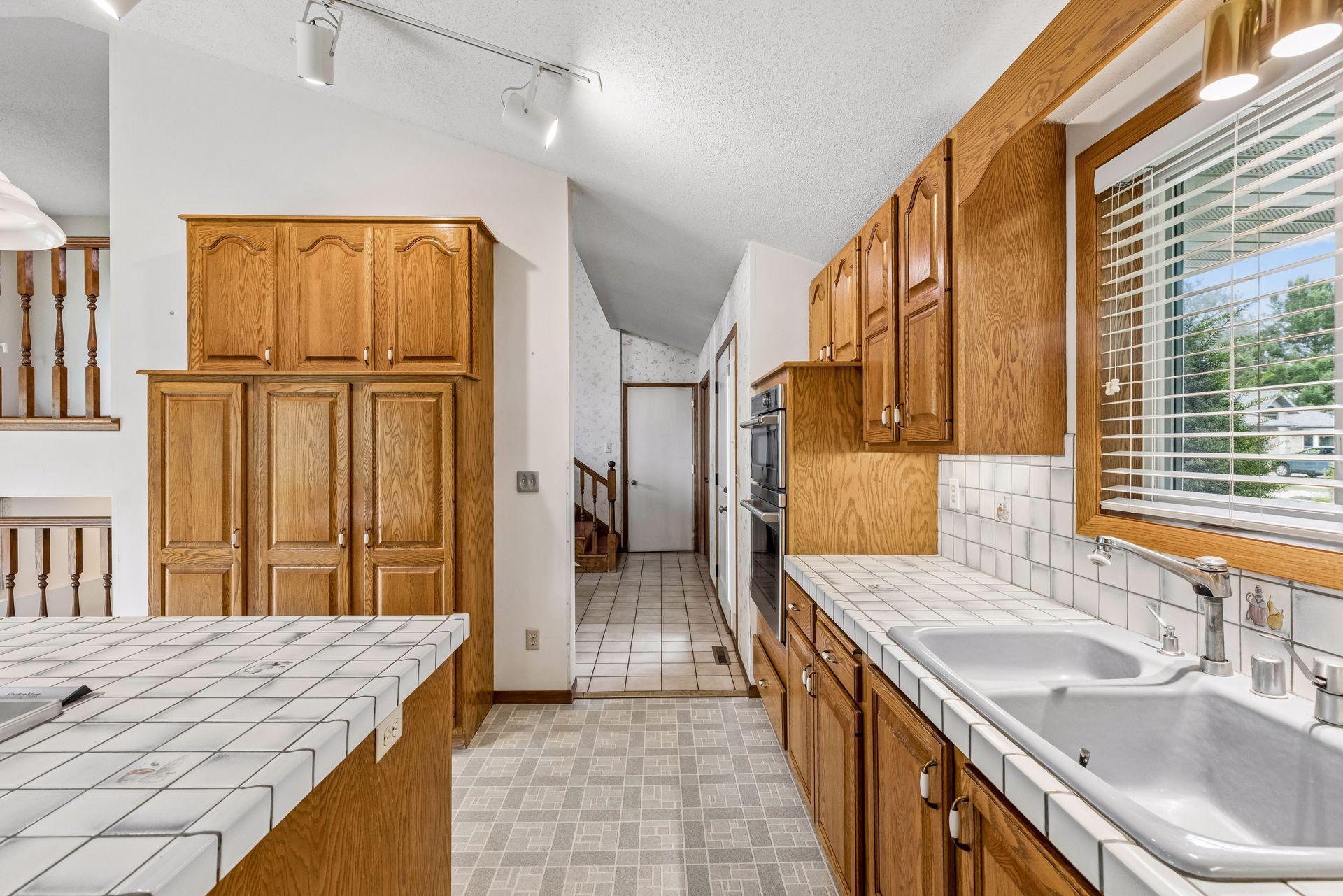 Excellent storage with an additional wall pantry.