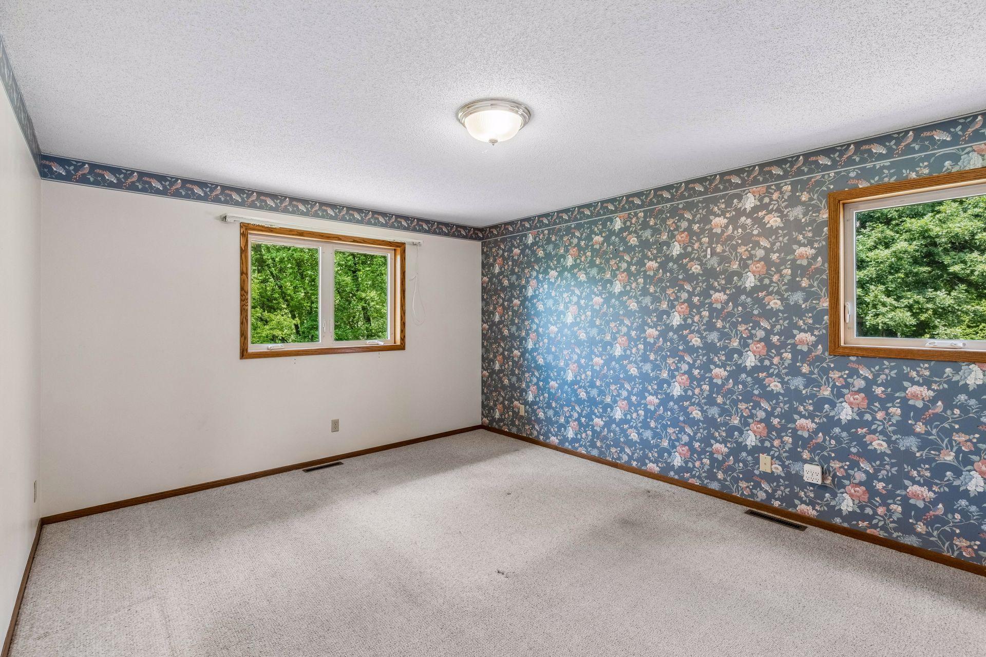 Primary suite includes a walk-in closet and private full bath with separate shower and jetted tub.
