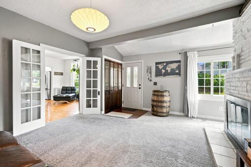 The living room is inviting and cozy. The french doors lead to dining room.