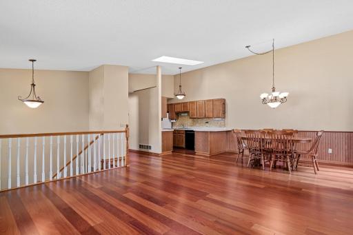 Functional living and entertainment space with skylight that allows for additional light. The flooring makes upkeep a breeze!