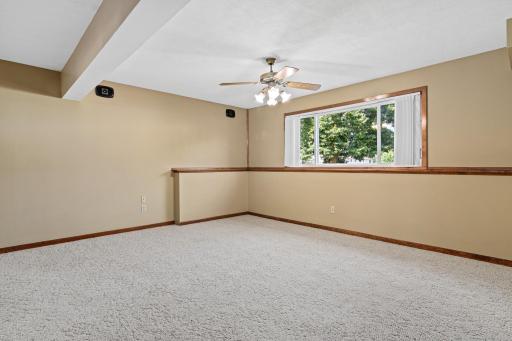 Lower level family room has a large window making it feel inviting.