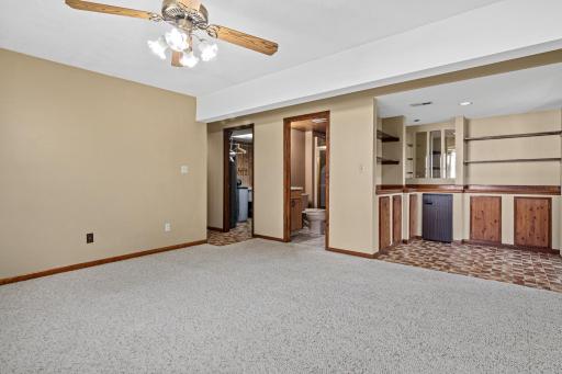 View from family room looking toward laundry, bathroom and bar area.