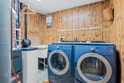 Lower level laundry with full size washer/dryer and newer HVAC/water softener items.
